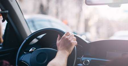 A man in a car driving