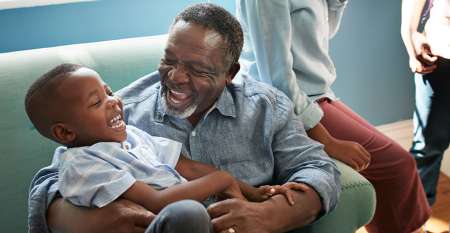 Man and young boy laughing