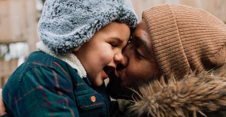 Man hugging young child