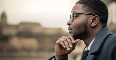 Thoughtful young man looking into the distance