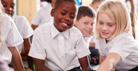 Smiling young children at community school